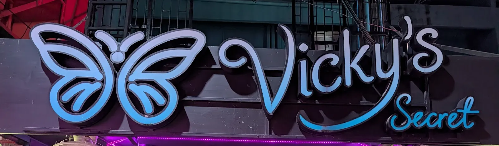 Close-up of the Vicky's Secret butterfly sign